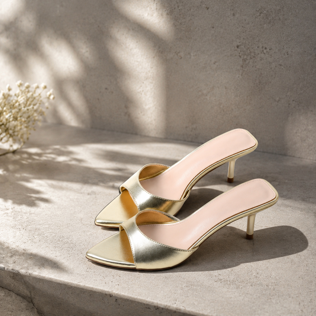 Warm Gold Junia Patent Thin-Heel Mules styled scene
