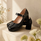 Deep Black Violetta Buckle Patent Flats styled scene