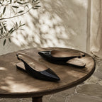 Deep Black Velia Buckle Leather Flats styled scene